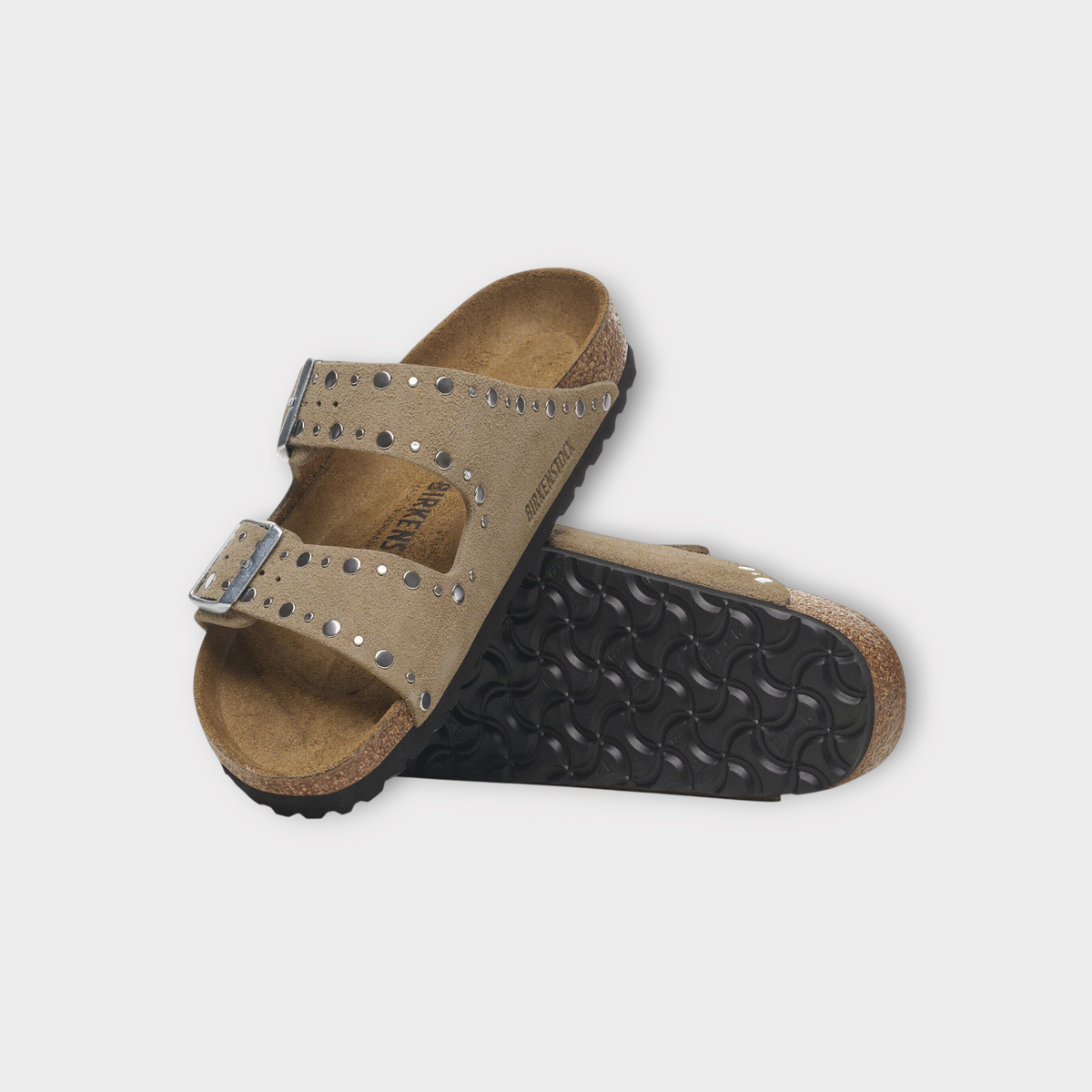 Drop Birkenstock Arizona taupe suede sandals with silver rivet stud detailing and dual adjustable buckle straps.