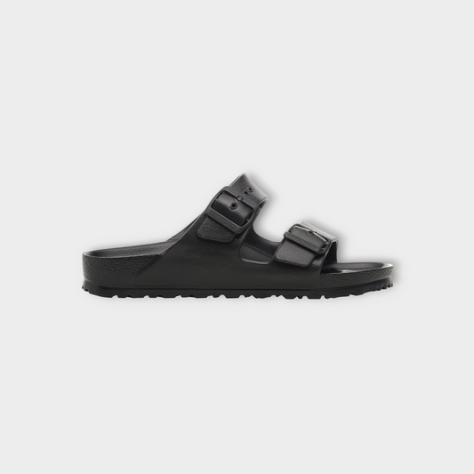 Drop Birkenstock Arizona EVA sandals in black with dual adjustable straps and contoured footbed, side view