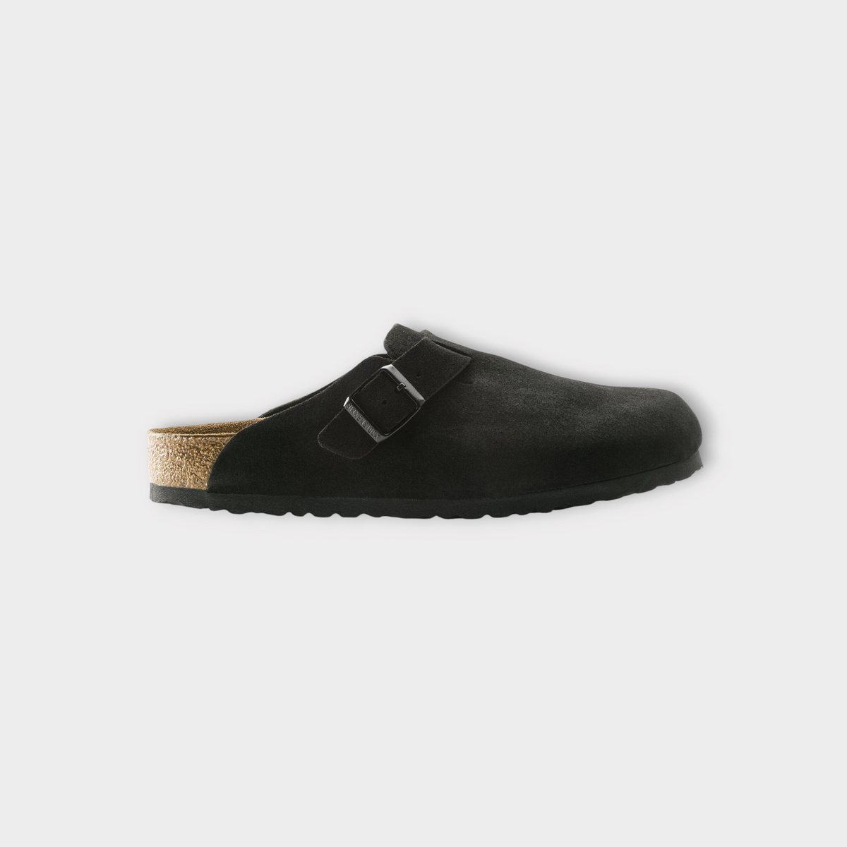 Drop Birkenstock Boston black suede clog with adjustable buckle strap and signature cork footbed, side profile view.
