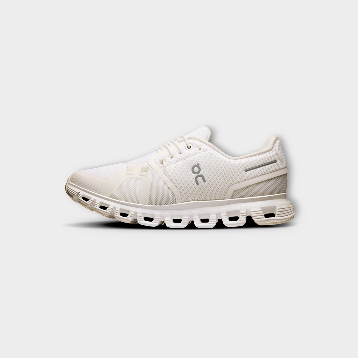 Drop On Cloud 6 women's running shoe in all-white with breathable mesh upper and signature cushioned sole