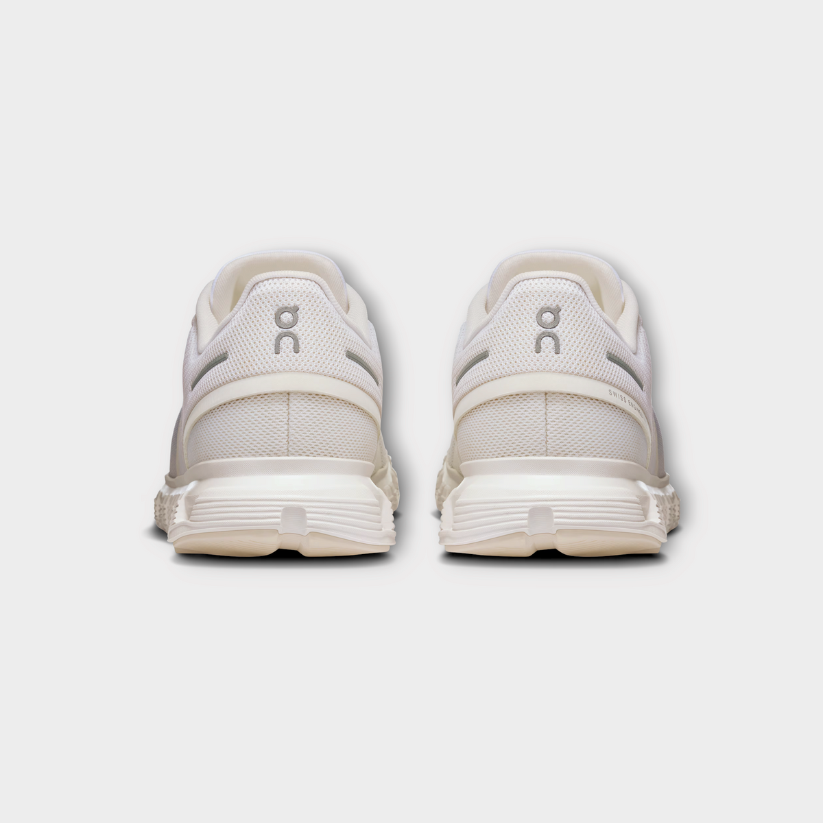 Drop On Cloud 6 women's running shoes in all-white, showing a rear view of the mesh heel and cushioned sole.