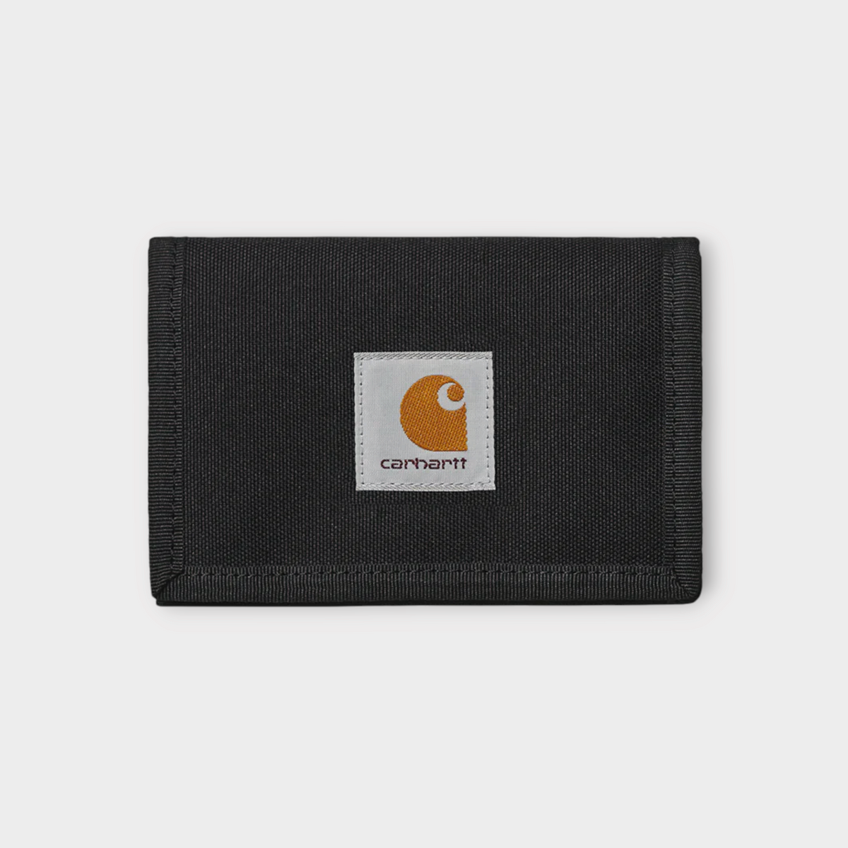 Drop Carhartt WIP Alec wallet in black durable fabric with a square logo patch on the front