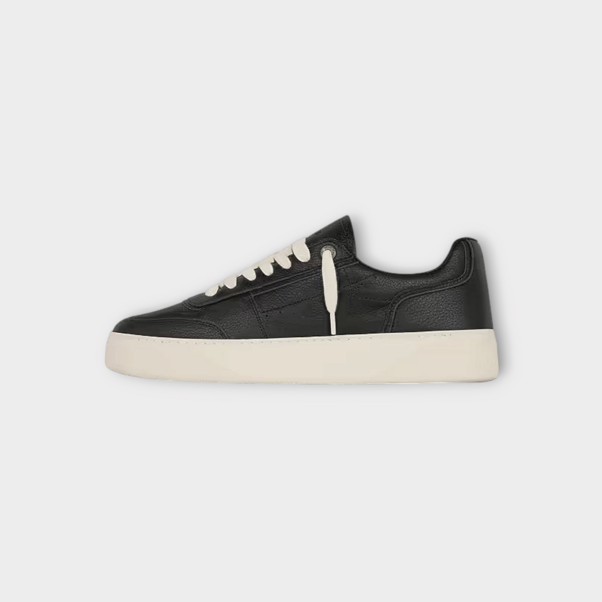 Drop Represent Initial leather sneaker in black with a contrasting white sole and laces, side profile view.