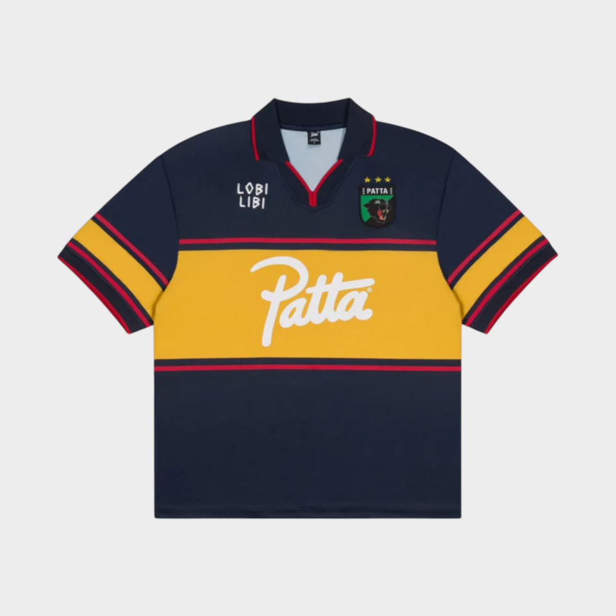 Drop Patta Legacy football jersey in Parisian Night navy blue with a yellow chest stripe and white logo branding.