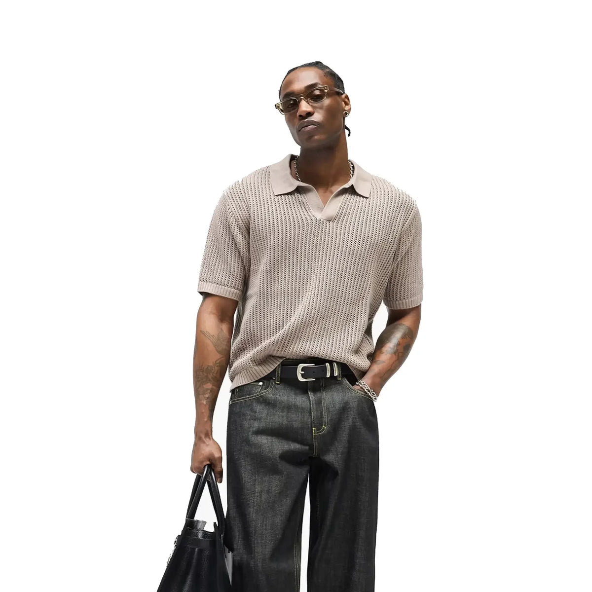 Model wearing the Represent Beverly knit polo in vintage khaki