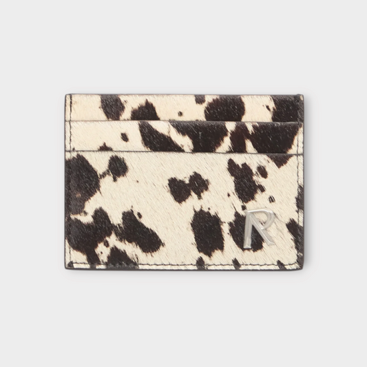 Drop Represent cow hide card holder in flat white and jet black with a silver logo detail