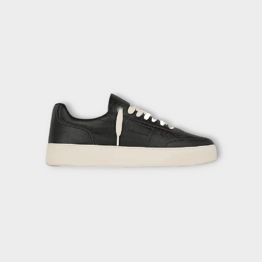 Drop Represent Initial black leather sneaker with a thick white rubber sole and white laces, side view.