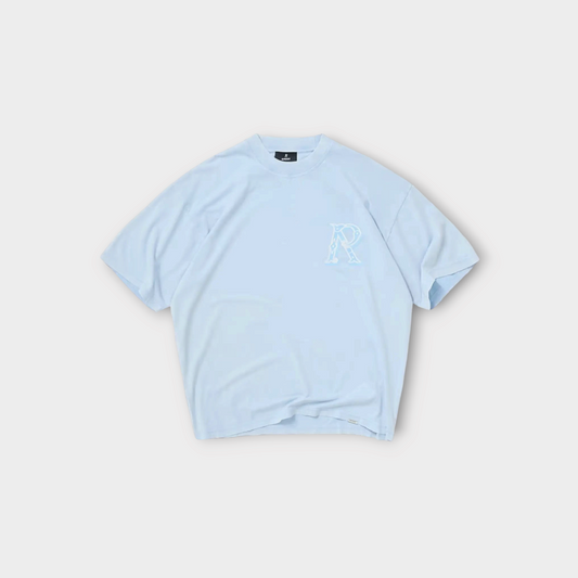 Drop Represent Western Initial T-Shirt in mountain bluebird light blue with a white embroidered R logo on the chest.