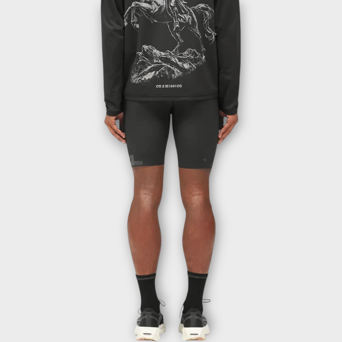 Drop 247 Ghost Short in jet black worn by a model, featuring a fitted athletic design for performance training.