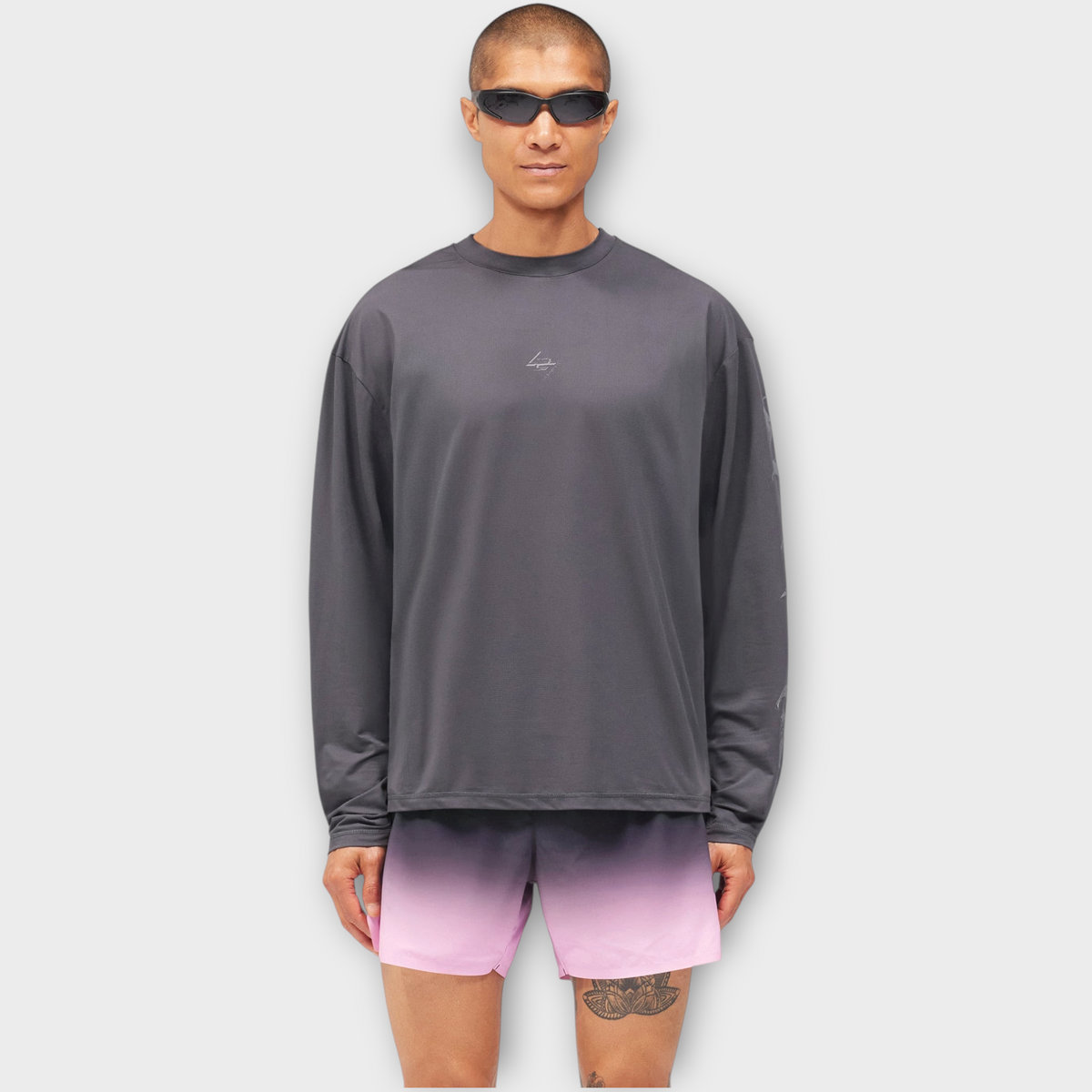 Drop 247 Knight LS T-shirt in graphene grey worn by a model with sunglasses against a plain white background