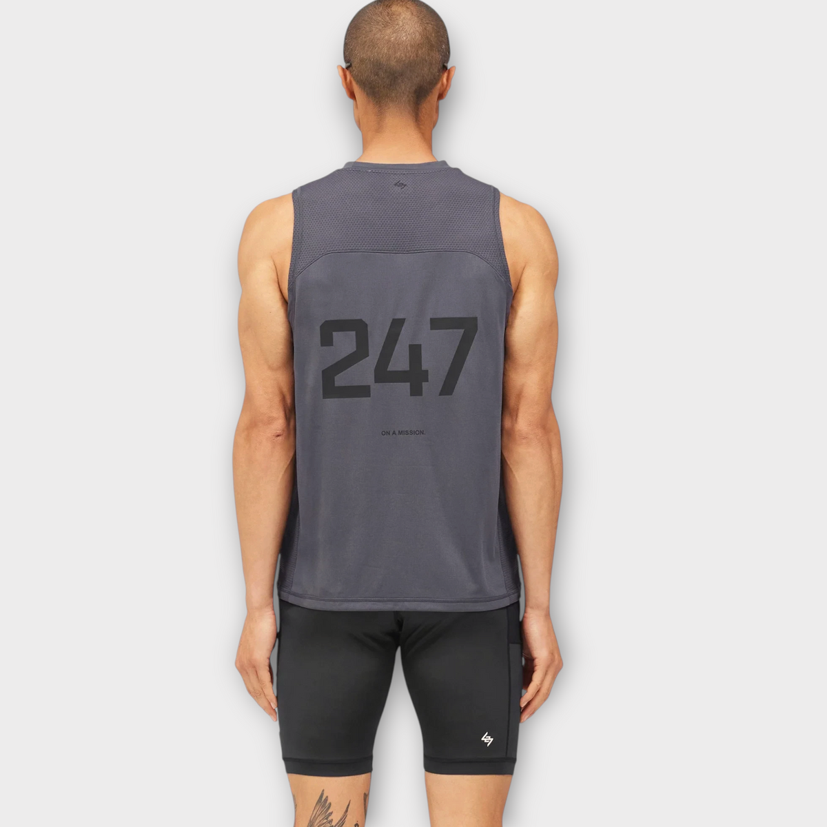 Drop 247 FW26 Numbers Vest in graphene grey, featuring a mesh back panel and bold 247 graphic on the back.
