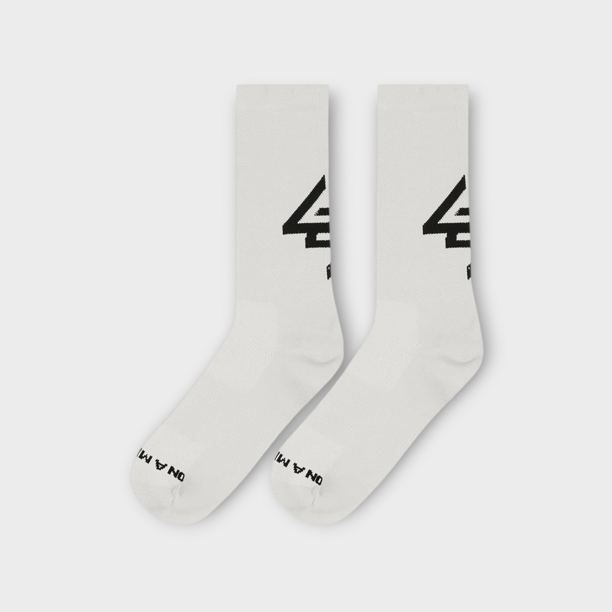 Drop 247 Reflex Run crew socks in flat white with black branding detail on the side