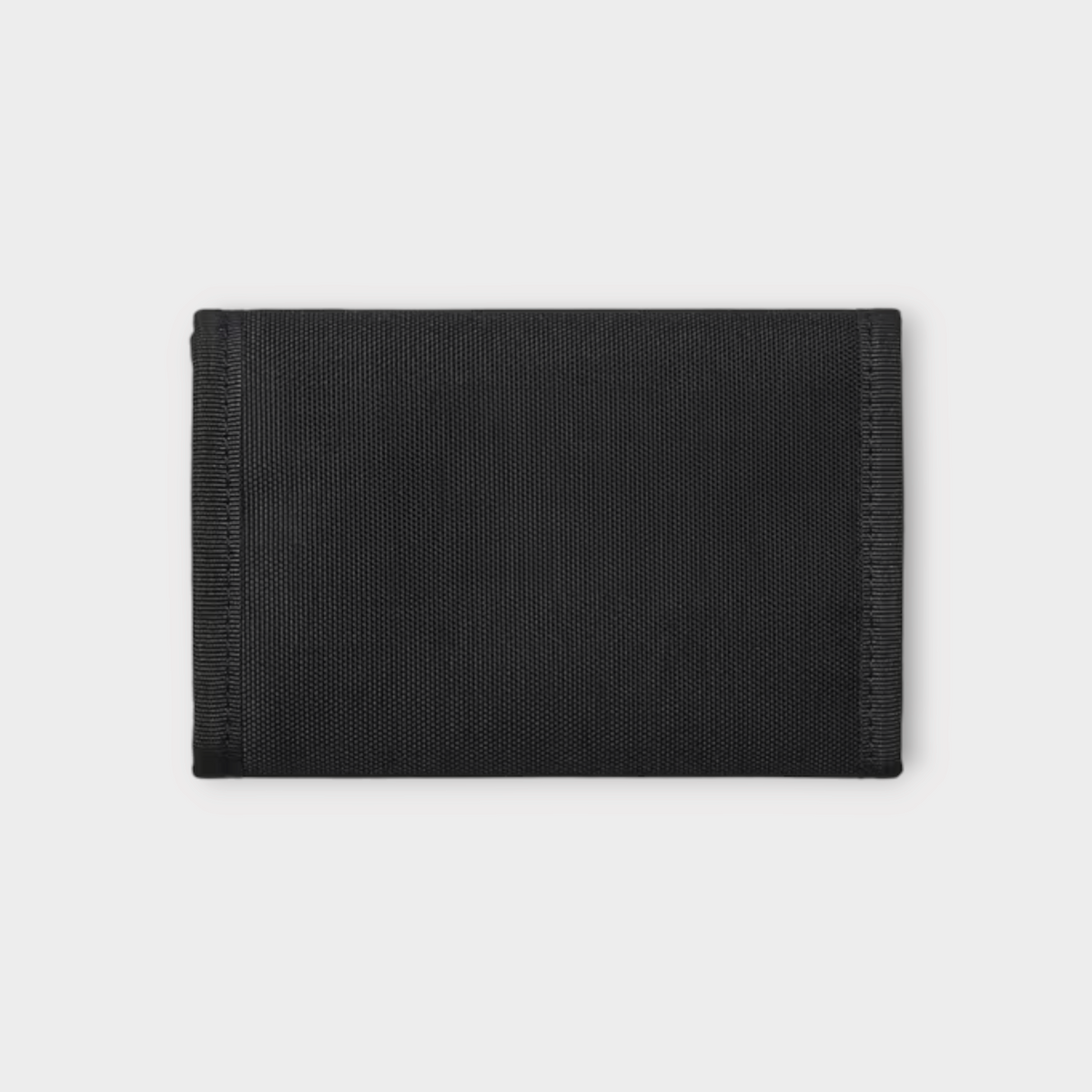 Drop Carhartt WIP Alec wallet in black durable canvas fabric with a minimalist tri-fold design