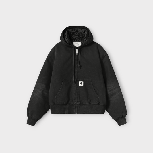 Drop Carhartt WIP women's OG active jacket in black stone-washed canvas with a quilted lining and front pouch pocket.