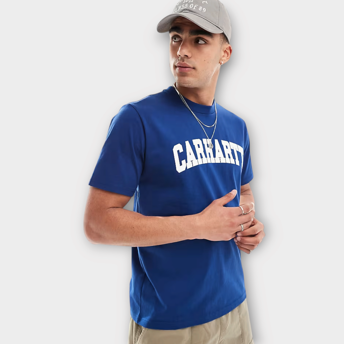 Drop Carhartt WIP university blue cotton t-shirt with white logo print worn by a man in a grey cap