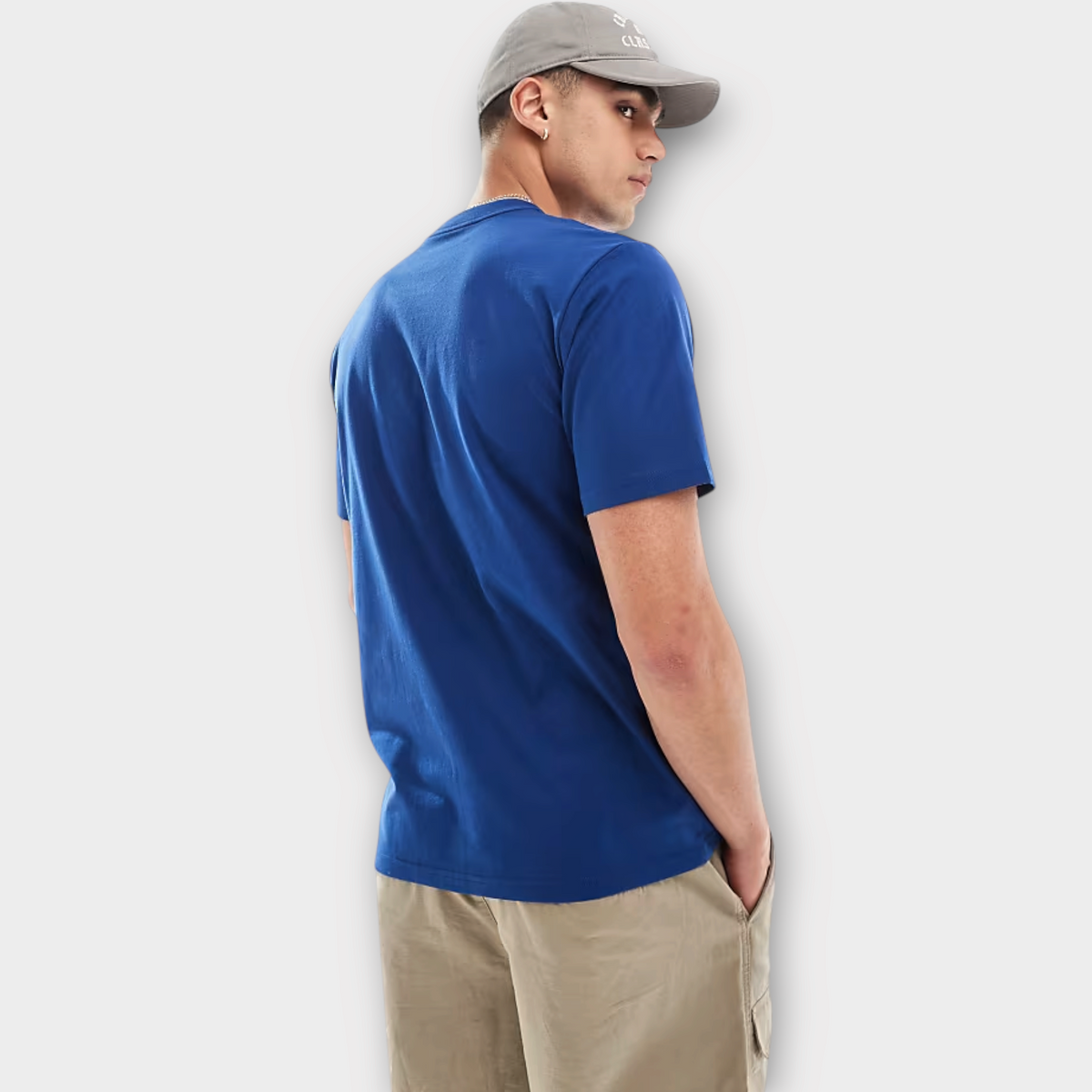 Drop Carhartt WIP university blue cotton t-shirt worn by a model in a grey cap and beige cargo shorts, back view