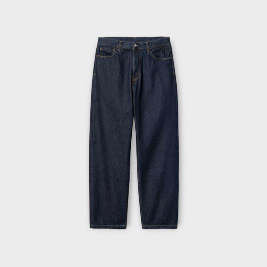 Drop CARHARTT WIP Landon Pant in rinsed blue denim with a relaxed fit and classic five-pocket styling.