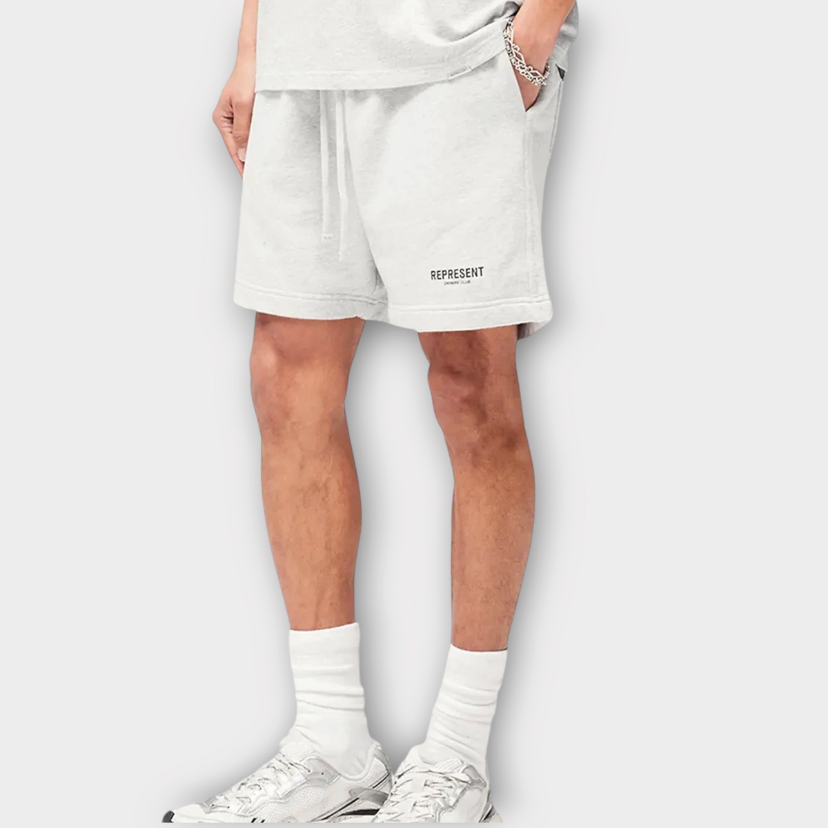 Drop Represent Owners Club ash grey cotton jersey shorts with black logo branding worn by a model