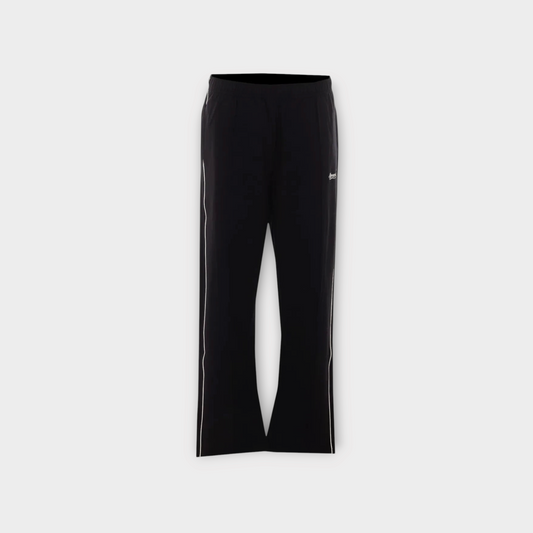 Drop Represent black track trousers with white side taping and a straight leg fit