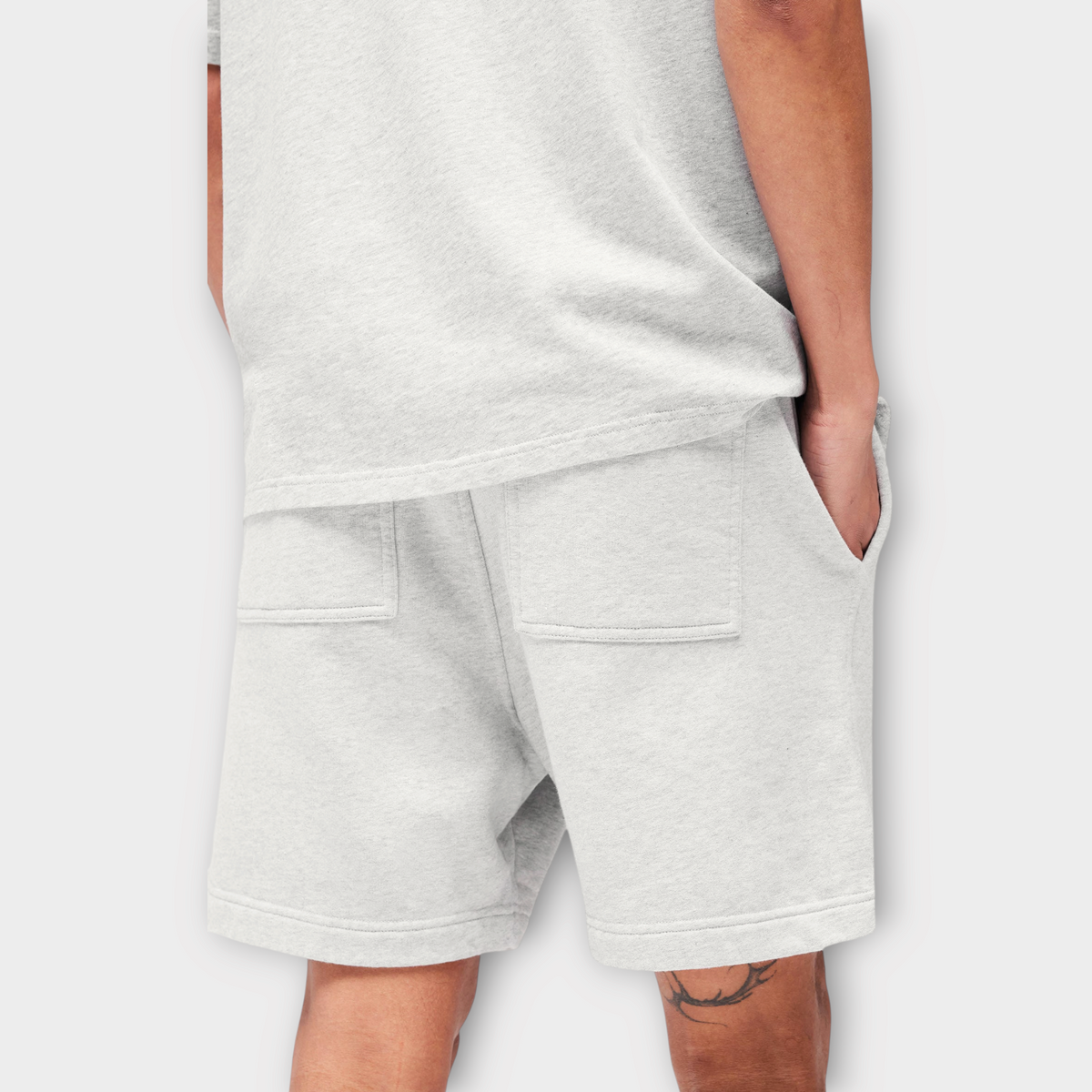 Drop Represent Owners Club ash grey cotton jersey shorts with back pockets worn by a model
