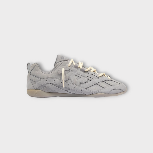 Drop Represent Rally sneakers in grey suede with cream laces and a low-profile gum sole, side view.