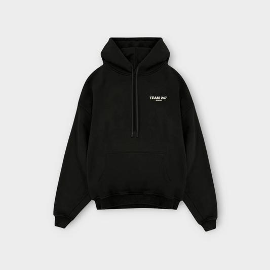 Drop Represent Team 247 black oversized hoodie with a front kangaroo pocket and white chest logo branding.